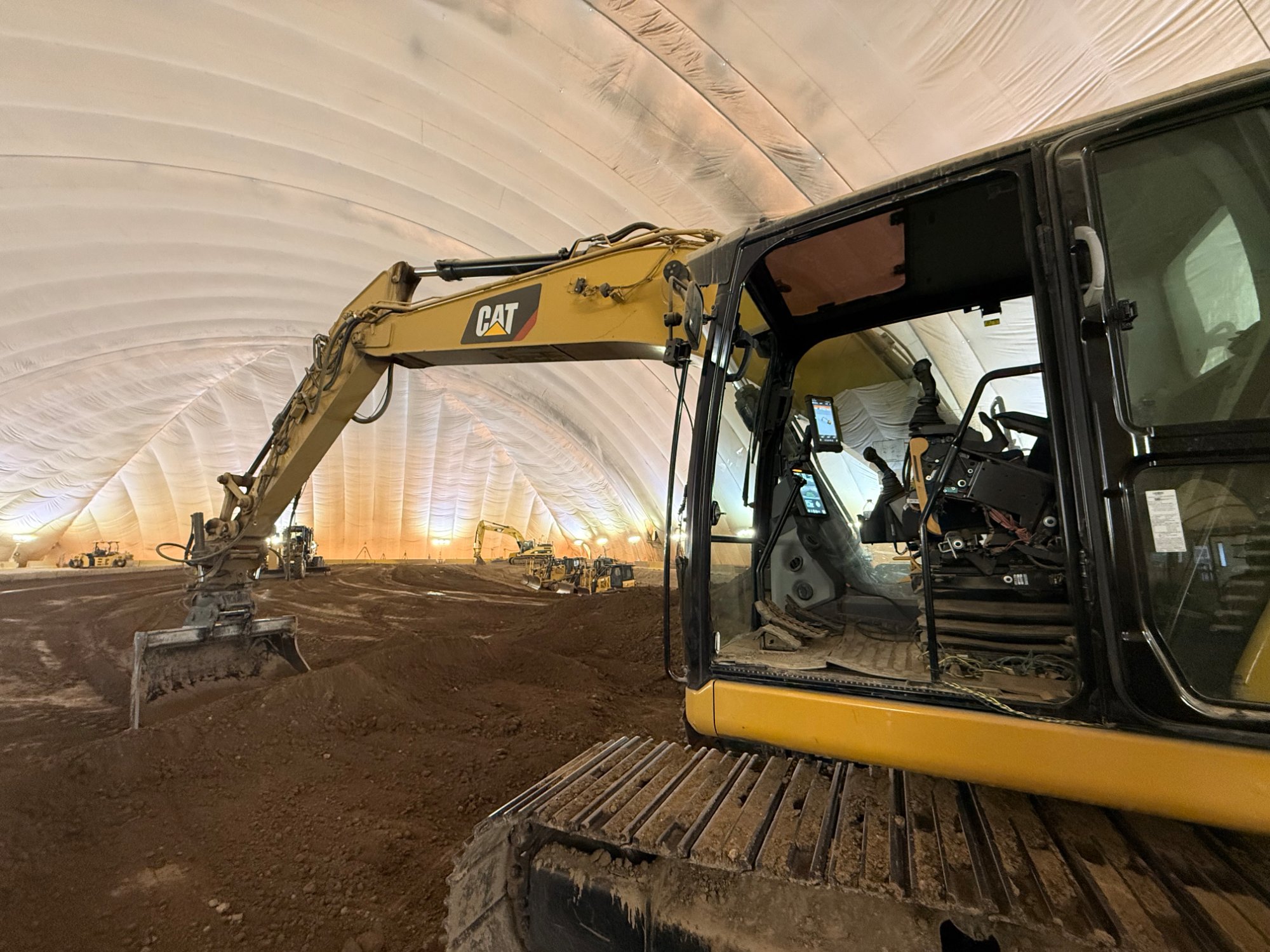 CAT excavator in dome
