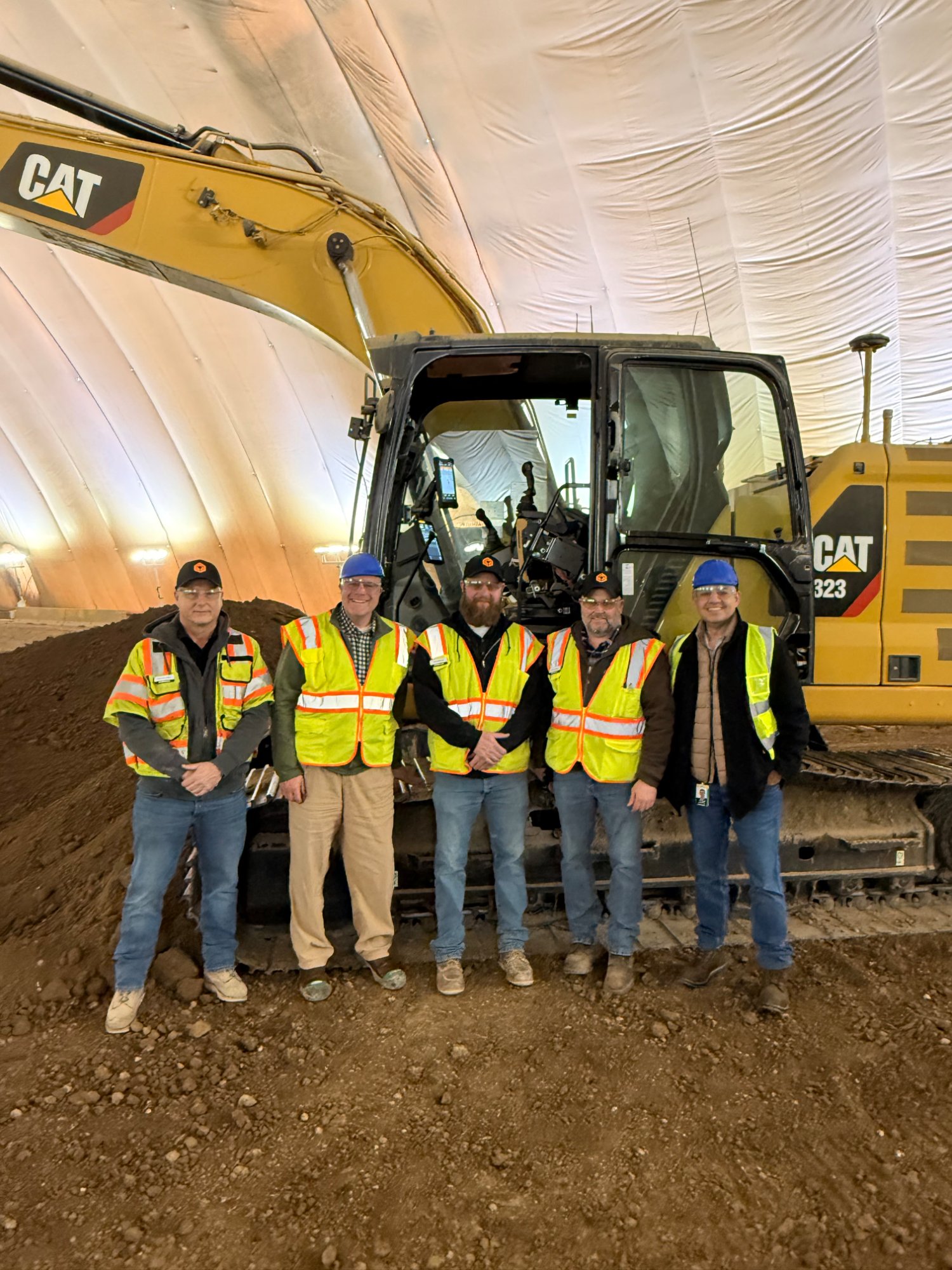 Team with CAT excavator
